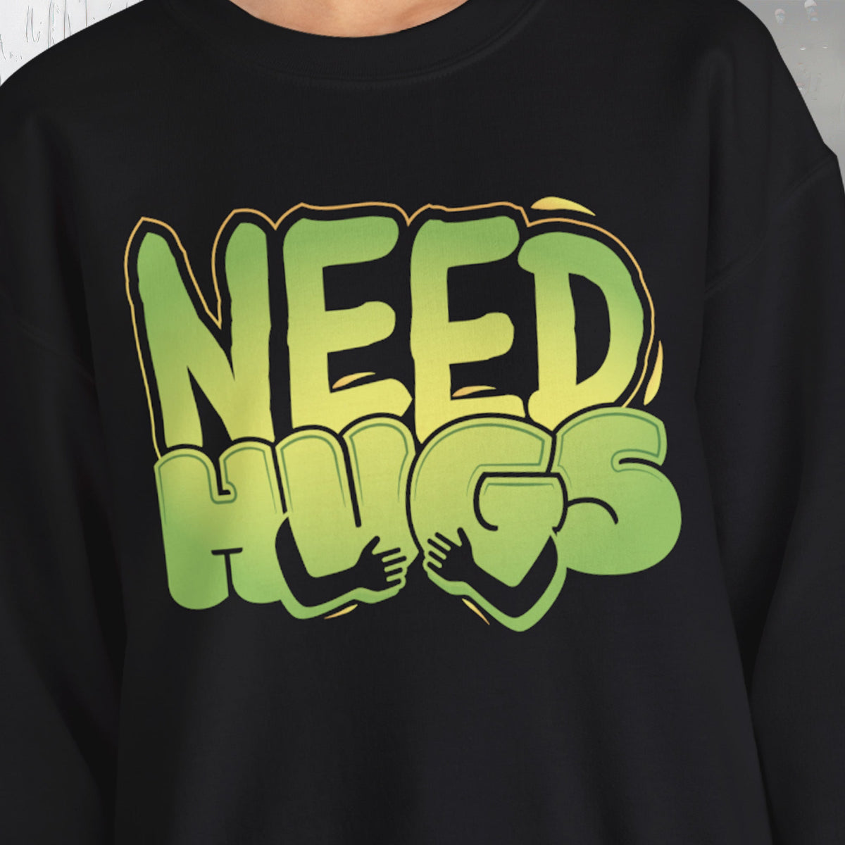 Need Hugs sweatshirt design – warm, comforting graphic for self-care and supportive gifting | closeup